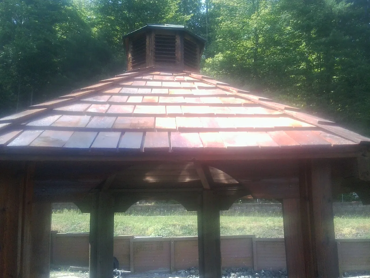 New cedar shake roof and cupola on a lakeside gazebo in Bird Island